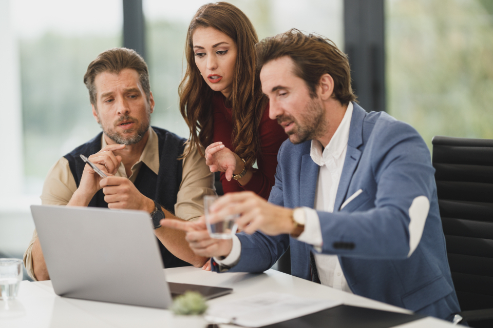SenaPBX team members reviewing work together